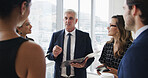 Manager, documents and business people in meeting in office for feedback, financial review and planning. Corporate, presentation and boss with workers with report for strategy, project and proposal