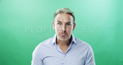 Buy stock photo Sulking, portrait and businessman with negative emotion in studio or oops, mistake and upset. Face expression, unhappy and mature professional with raised eyebrow, anxiety and green background