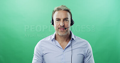 Buy stock photo Businessman, portrait and consultant with headset on green background for communication in studio. Male person, agent or model with smile or mic for online advice or customer service on mockup space