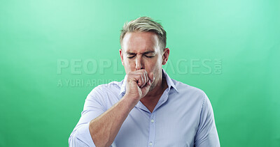 Buy stock photo Coughing, sickness and virus with man in studio for allergies, influenza symptoms and illness. Fatigue, sinus congestion and healthcare with person on green background for infection, space and cold