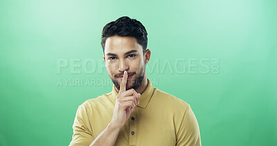 Buy stock photo Portrait, man and shush for secret in studio for gossip, privacy sign and silence for rumor. Person, mockup space and quiet gesture for mystery, confidential news and announcement on green background