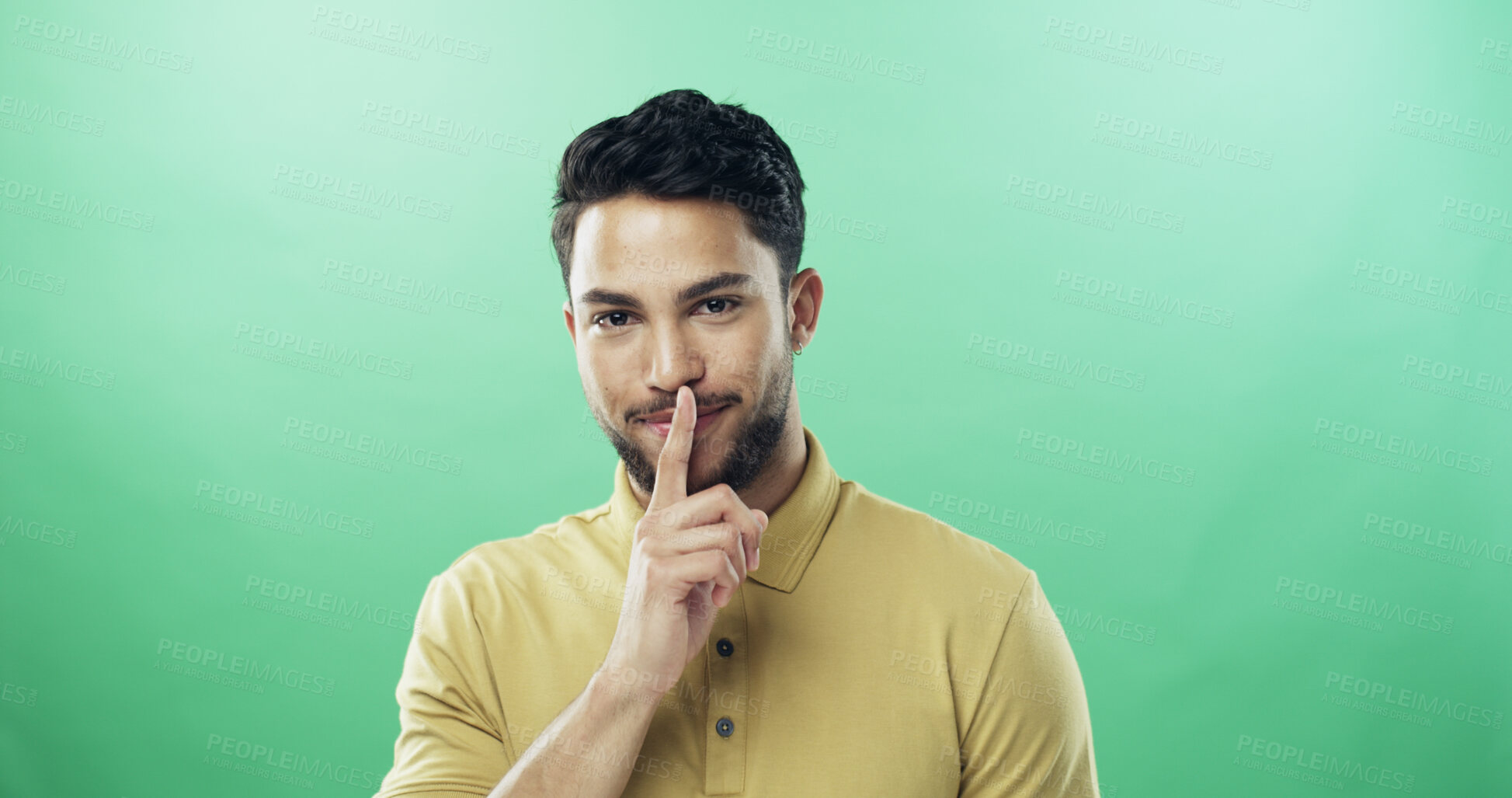 Buy stock photo Portrait, man and shush for secret in studio for gossip, privacy sign and silence for rumor. Person, mockup space and quiet gesture for mystery, confidential news and announcement on green background
