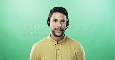 Buy stock photo Man, headset and happy in studio for call center, advice and mockup space with talk by green background. Person, agent and sales consultant with voip mic, contact us or smile for telemarketing job