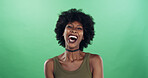 Portrait, happy and laugh with black woman on green screen for funny joke, comic reaction and crazy story. Female person, space and silly expression for comedy, feel good and attitude on background
