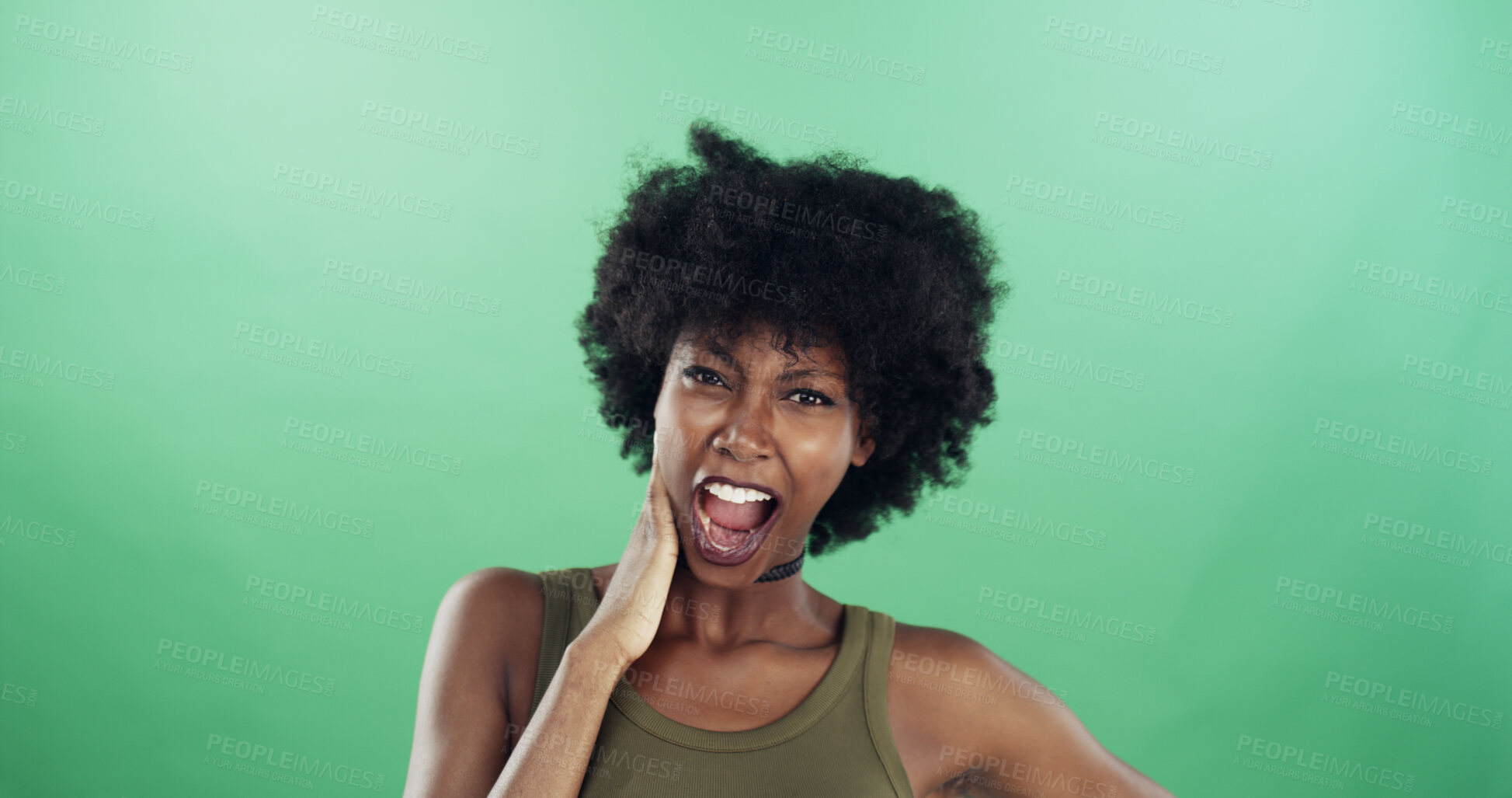 Buy stock photo Portrait, funny face and black woman in studio, expression and confident personality on green background. African person, pride or happy model with goofy emoji, silly and smile with humor or reaction