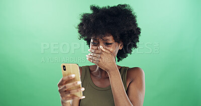Buy stock photo Crying, phone and reaction with black woman in studio for communication of bad news or update. App, grief and social media with shocked African person gasp on green background for mobile notification