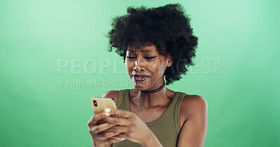 Buy stock photo Crying, phone and text message with black woman in studio for communication of bad news or update. App, tears and social media with unhappy African person on green background for notification