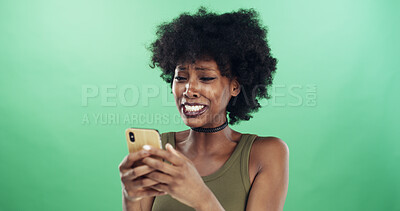 Buy stock photo Phone, sad and text message with black woman in studio for communication of bad news or update. App, crying and social media with unhappy African person on green background for mobile notification