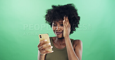 Buy stock photo Black woman, sad and phone in studio with texting, mistake and notification with breakup by green background. African girl, smartphone and stress with app, crying and announcement with mockup space