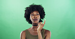 Thinking, choice and black woman in studio with ideas, decision or brainstorming for university. Problem solving, mockup space and African female student with planning for college by green background