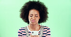Black woman, smartphone and frown with confused face in studio, scam or notification error with internet glitch. Email spam, fake news or web 404 on mobile app for connection fail on green background