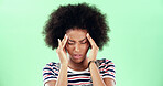 Green screen, headache and black woman on studio background with migraine, stress or pain. Frustrated, angry and burnout with temple massage, student person and sick with health risk for chromakey