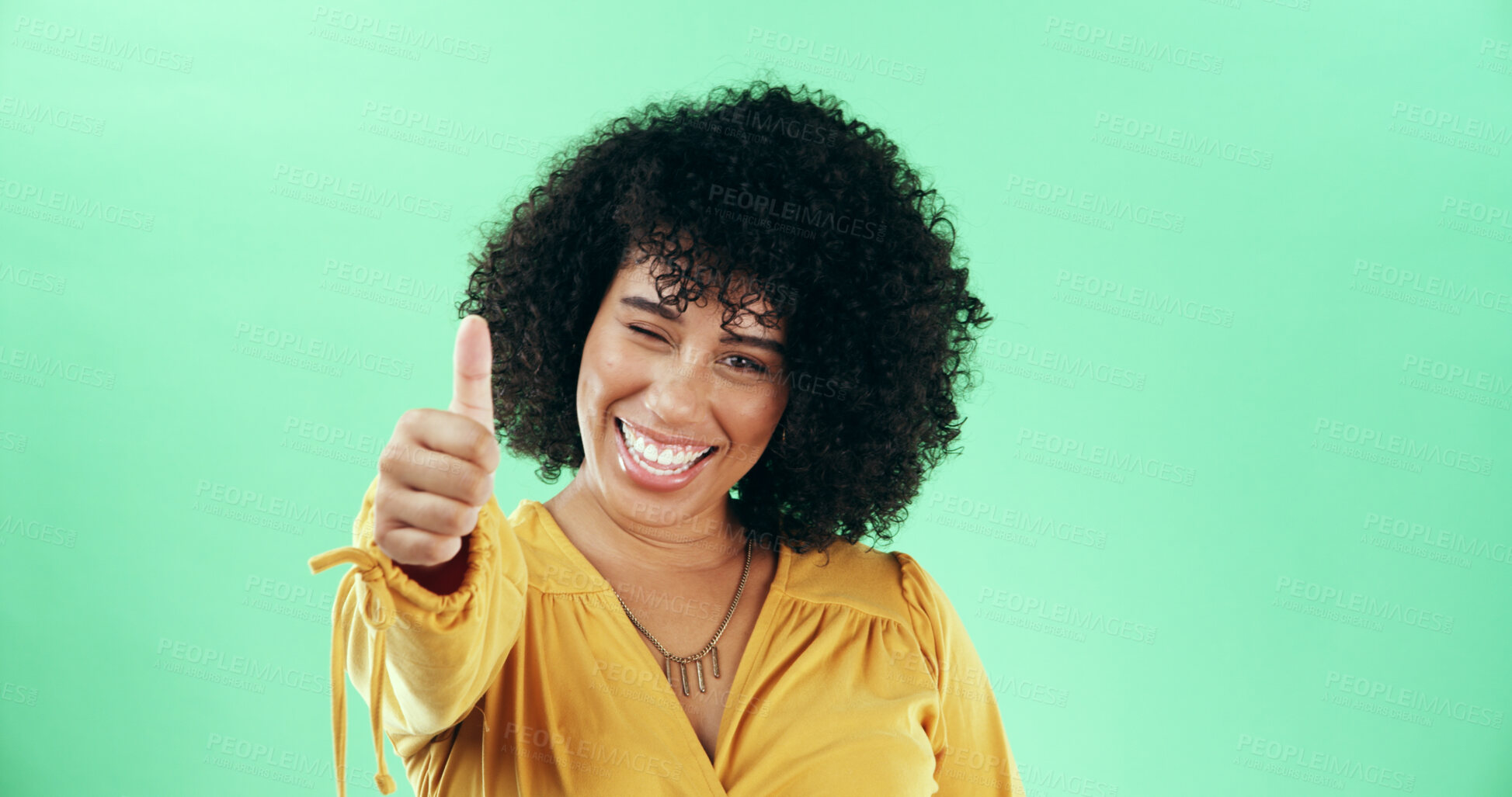 Buy stock photo Green background, woman and portrait with wink for thumbs up, agreement and yes sign with mockup. African female person, happiness and emoji reaction with hand gesture for opinion, review and studio