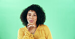 Portrait, blowing kiss and woman in studio, smile and confident personality on green background. Face, happy person and model with hand gesture, kindness and symbol with love, flirting and romance
