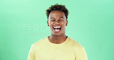 Buy stock photo Comic, funny or laughing with black man on green background in studio for humor, joke and meme. Face, smile and comedy with happy African student, model and reaction with positive emotion and joy