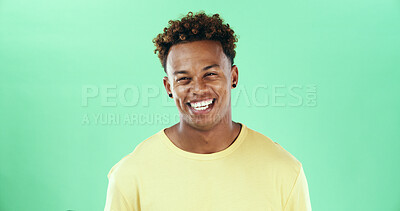 Buy stock photo Comic, funny and smile with black man on green background in studio for humor, joke and meme. Portrait, laugh and comedy with happy African student, model and reaction with positive emotion and joy