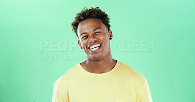 Buy stock photo Comic, laugh and smile with black man on green background in studio for humor, joke and meme. Face, funny and comedy with happy African student, model and reaction with positive emotion and joy