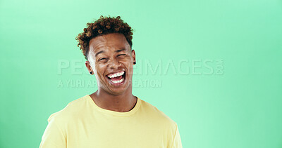 Buy stock photo Comedy, laugh and smile with black man on green background in studio for humor, joke and meme. Face, funny and comic with African student, model and reaction with positive gesture and mockup space
