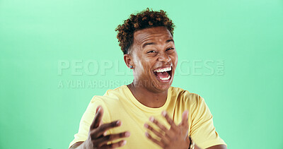 Buy stock photo Comic, funny or laughter with black man on green background in studio for humor, joke and meme. Portrait, smile and comedy with happy African student, model and reaction with positive gesture and joy