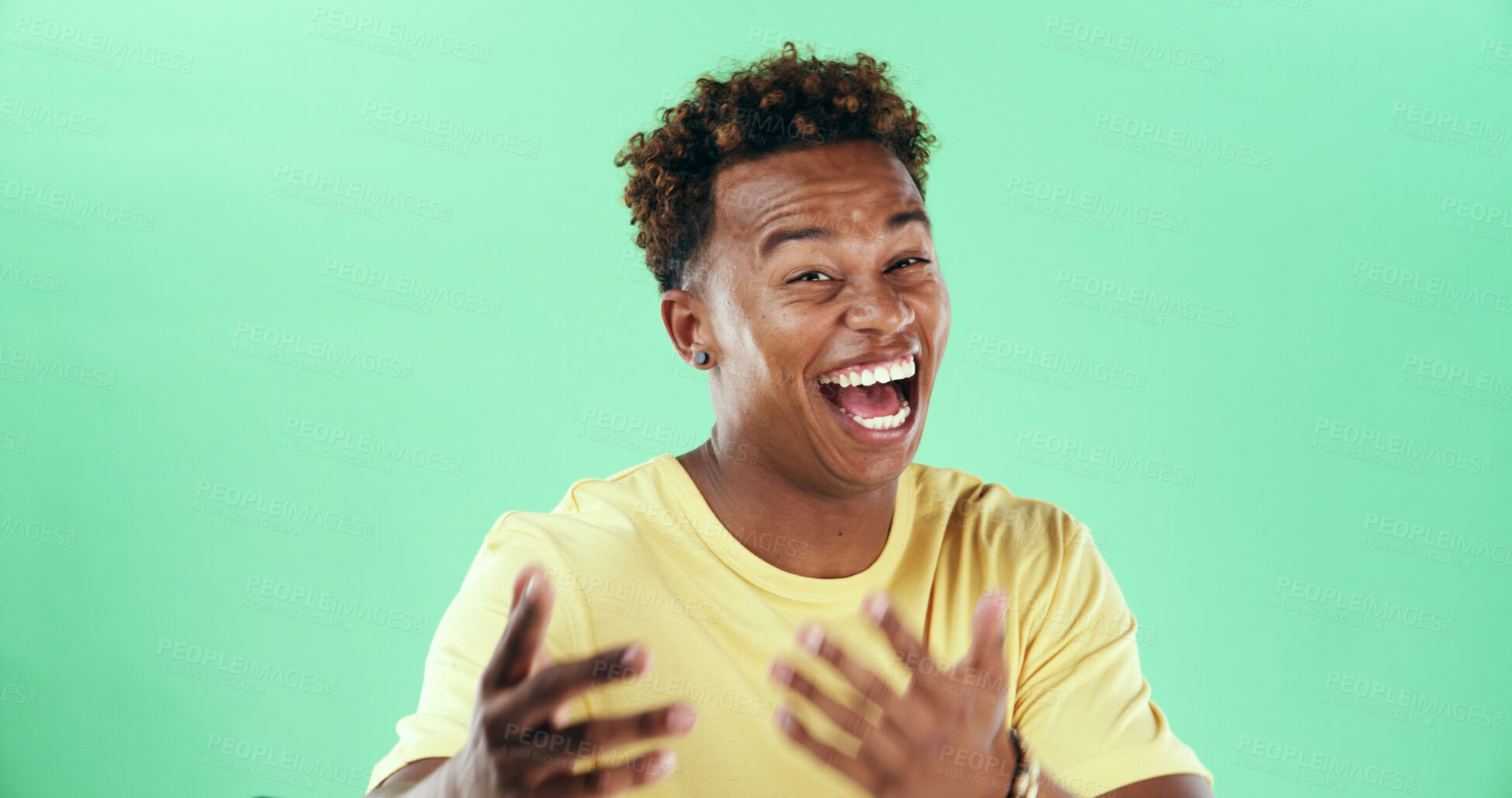 Buy stock photo Comic, funny or laughter with black man on green background in studio for humor, joke and meme. Portrait, smile and comedy with happy African student, model and reaction with positive gesture and joy