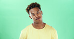 Goofy, funny face and smile with black man on green background in studio for humor, joke and meme. Portrait, crazy and comedy with happy African student, model and playful with expression and joy