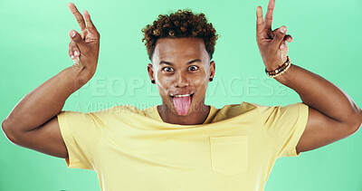 Buy stock photo Funny face, portrait and tongue out with black man on green background for comedy or humor as comic. Crazy, emoji and silly with person joking in studio for goofy or playful facial expression