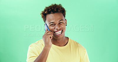 Buy stock photo Black man, phone call and smile in studio portrait with laugh, funny chat and listen by green background. African person, smartphone and happy with comic story, mock up space and gossip in Nigeria