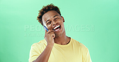 Buy stock photo Phone call, happy and man in studio for communication, conversation and laugh on a green background. Smartphone, funny joke and silly male person for contact, connection and networking by space