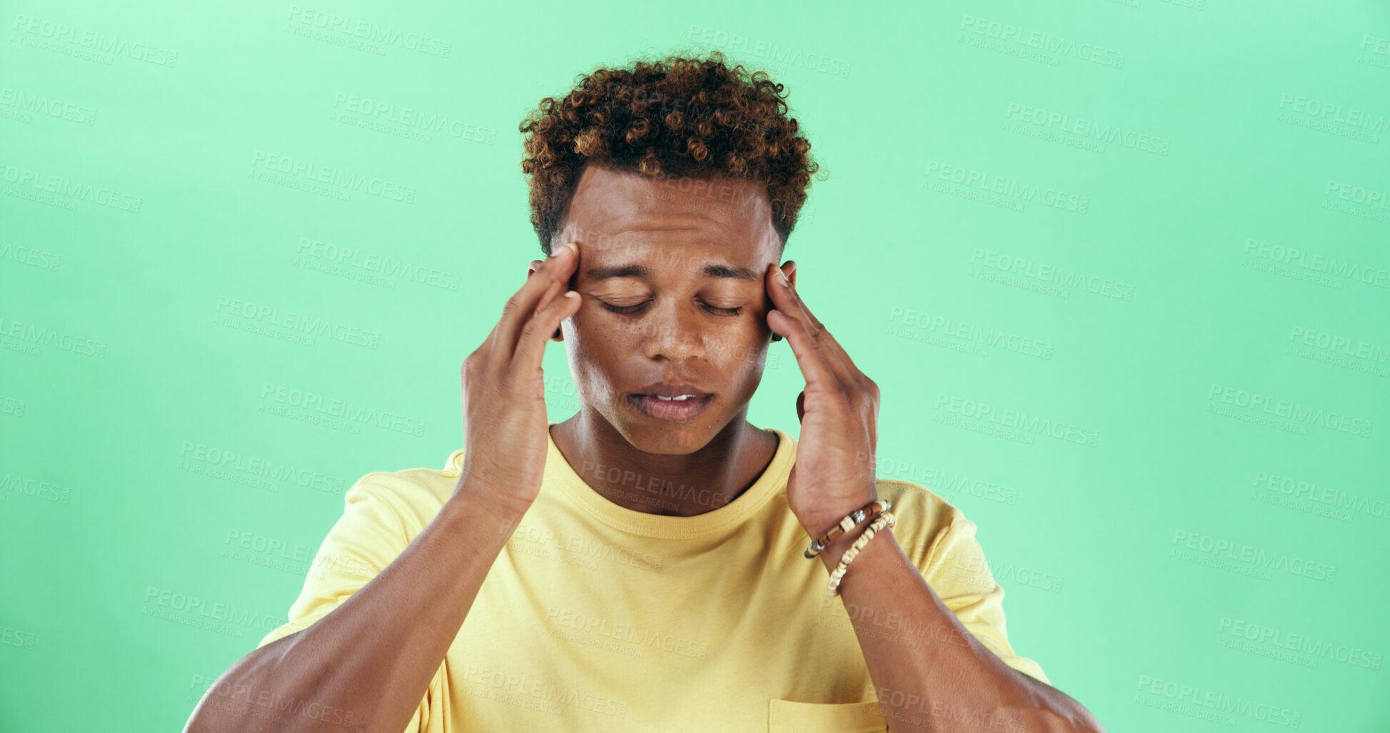 Buy stock photo Tired man, headache or stress in studio with green background for injury, burnout or anxiety. Male person, African model or pain with migraine for mental health, depression or fatigue on mockup space