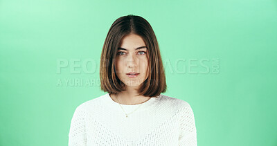 Buy stock photo Serious, woman and portrait of teacher in studio with confidence for career in education. Mockup space, professional and female educator from London with pride for job opportunity by green background