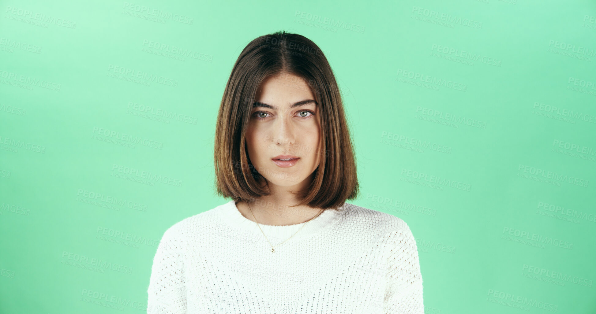 Buy stock photo Serious, woman and portrait of teacher in studio with confidence for career in education. Mockup space, professional and female educator from London with pride for job opportunity by green background