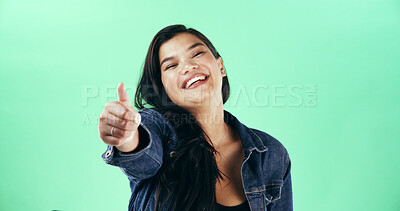 Buy stock photo Portrait, smile and thumbs up with woman is studio for celebration, success or yes reaction. Emoji, energy and like with happy person on green background for motivation as winner of competition