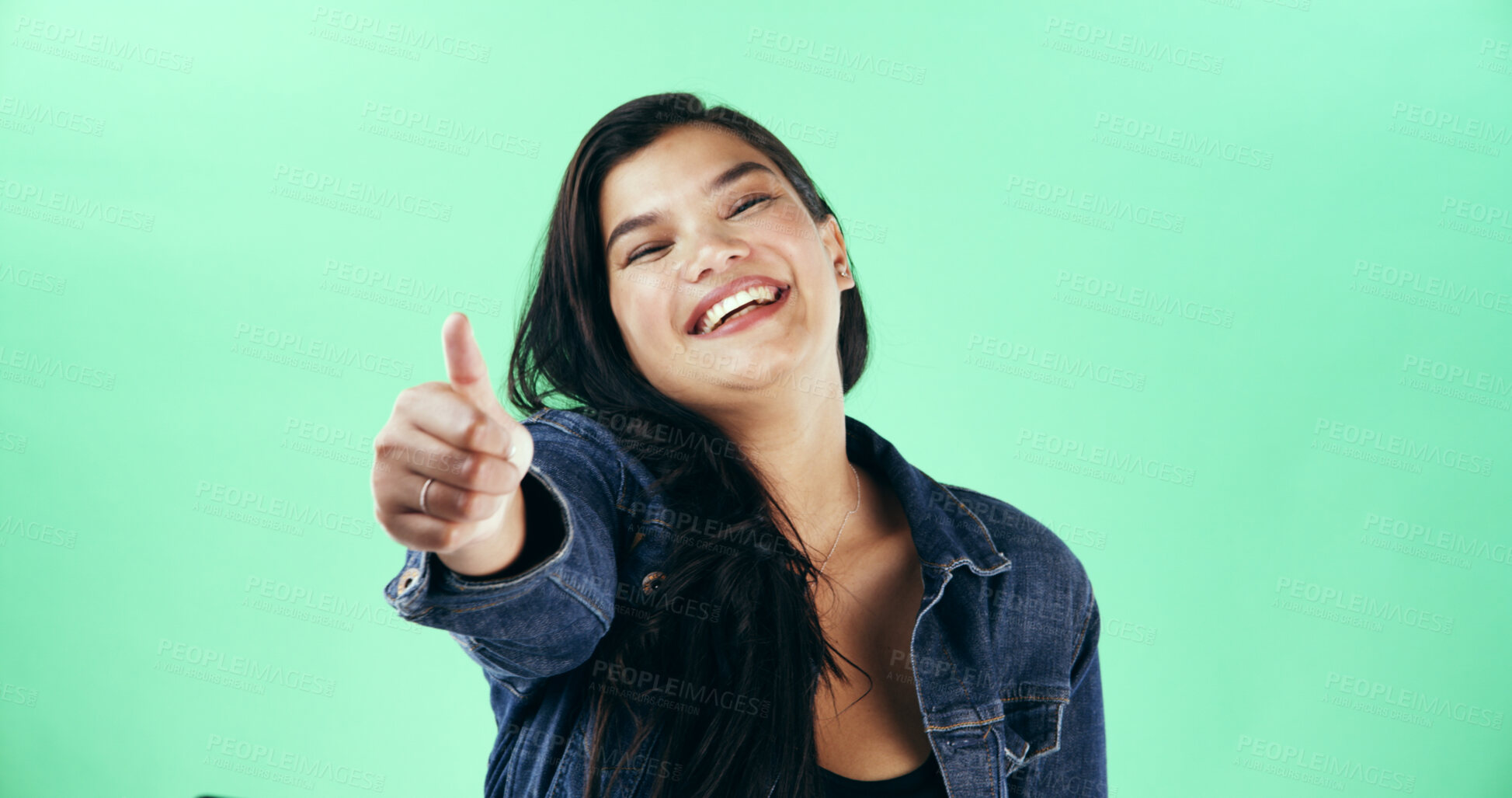 Buy stock photo Portrait, smile and thumbs up with woman is studio for celebration, success or yes reaction. Emoji, energy and like with happy person on green background for motivation as winner of competition