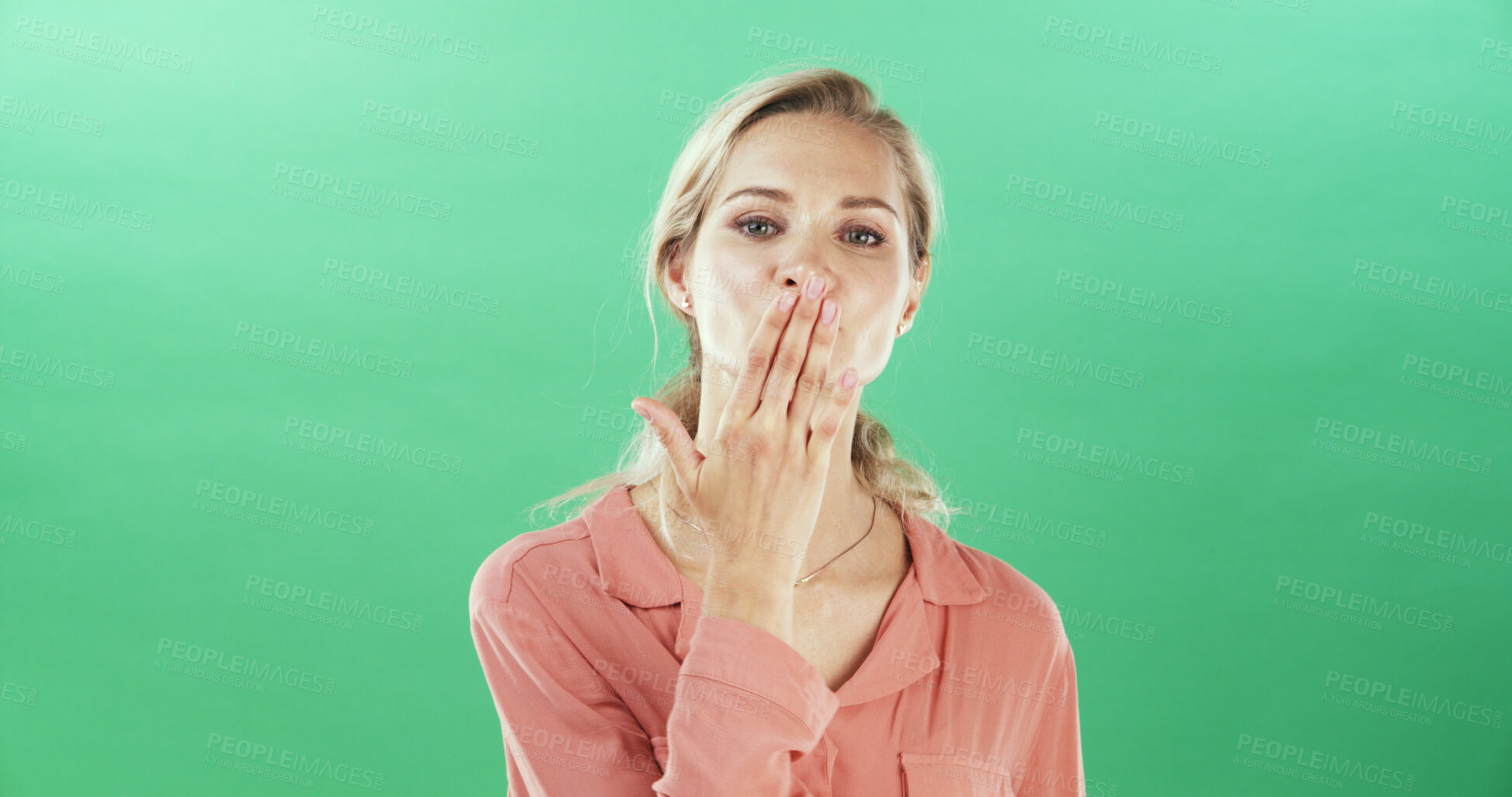Buy stock photo Portrait, woman and gesture to blow kiss for flirting, show  attraction and romantic in studio. Mockup space, female person and love emoji for valentines day, affection symbol and green background