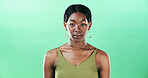Beauty, green background and portrait of black woman in studio with confidence, makeup and cosmetics. Fashion, aesthetic and isolated person with accessories for trendy clothes, outfit and stylish