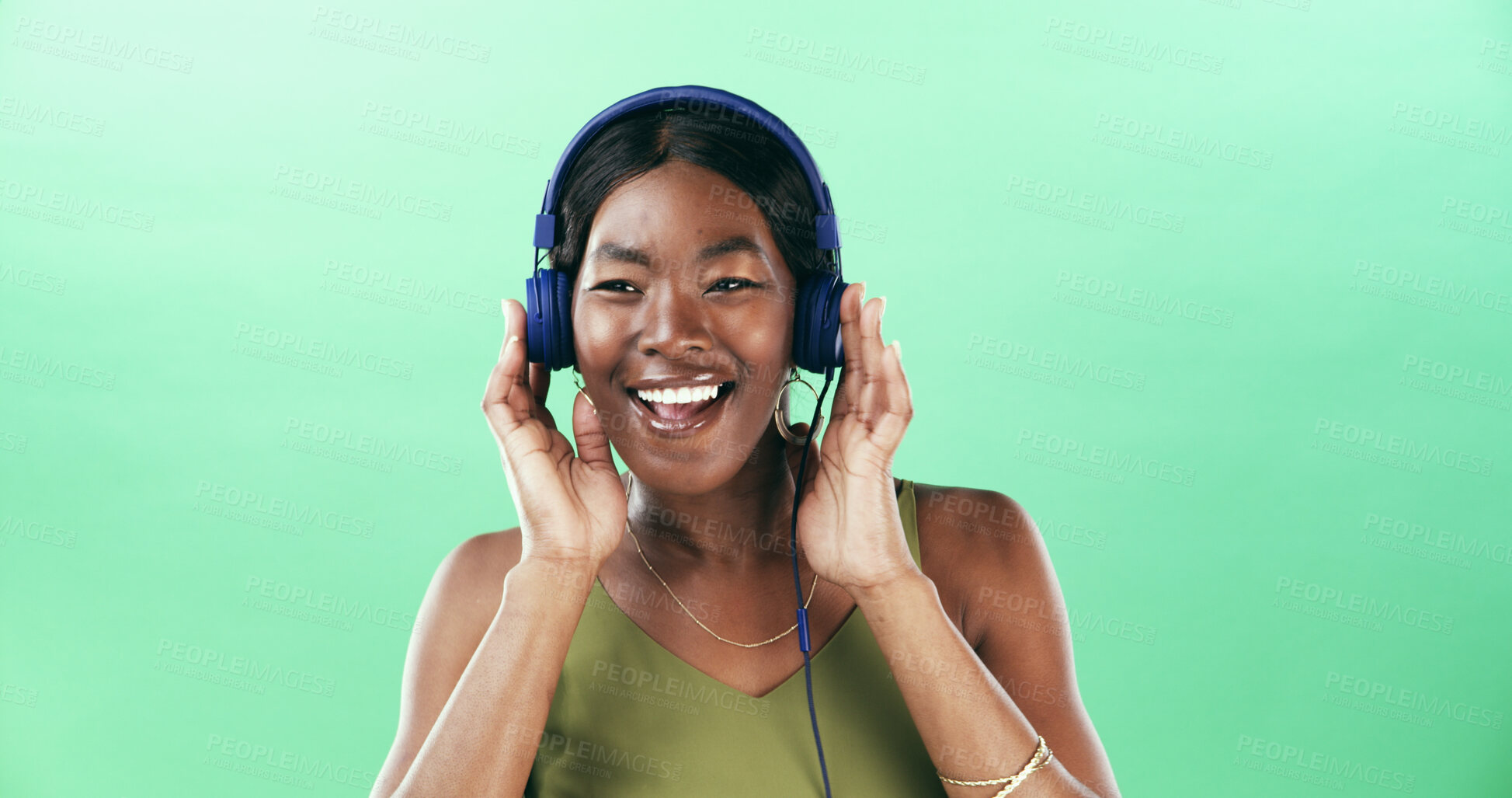 Buy stock photo Music, radio and headphones with black woman in studio for streaming, audio playlist and song. Performance, sound and dancing with female person on green background for entertainment and space
