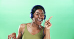Excited, dancer and headphones with black woman in studio for streaming, audio playlist and music. Performance, sound and dancing with female person on green background for entertainment and space
