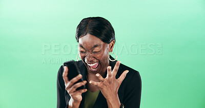 Buy stock photo Happy, black woman and screaming with phone for good news or winning on a green studio background. Female person, employee or winner shouting with surprise on mobile smartphone for bonus or promotion