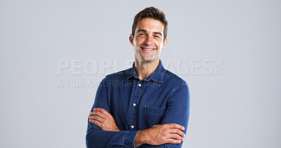 Buy stock photo Happy, fashion and man with arms crossed, studio and trendsetter with streetwear, pride or creative. White background, portrait or person with trendy denim, mockup space or stylist with outfit in USA