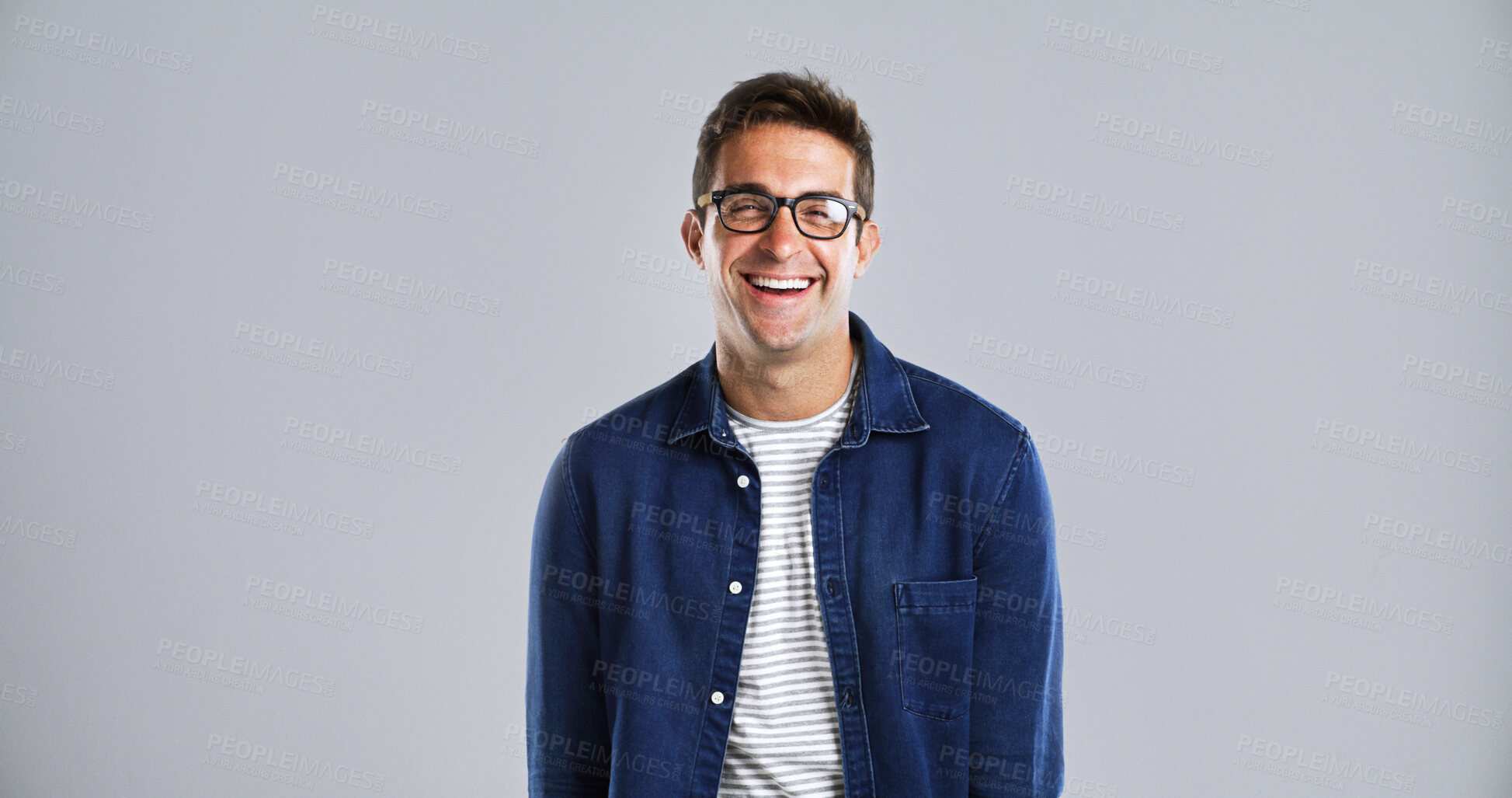 Buy stock photo Happy man, portrait and glasses for fashion or vision, trendy eyewear and stylish in studio. Designer frame, spectacles and laughing with denim style, space and prescription lens on white background