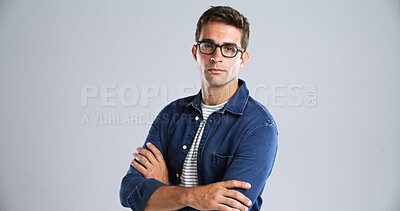Buy stock photo Optometry, glasses and portrait of man in studio with confidence for eye health, vision or wellness. Crossed arms, ophthalmology and person with optic prescription for spectacles by white background.