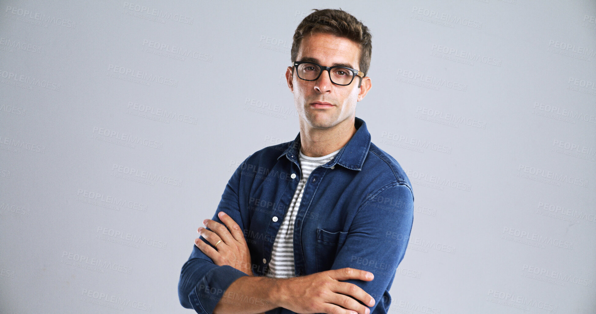 Buy stock photo Optometry, glasses and portrait of man in studio with confidence for eye health, vision or wellness. Crossed arms, ophthalmology and person with optic prescription for spectacles by white background.