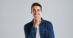 Portrait, man and thinking with smile in studio for planning, ideas and positive attitude. Mockup space, male person and happy for problem solving, good news and choice of solution on gray background