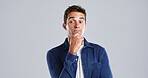 Thinking, man and doubt for solution in studio for planning, ideas and guess expression of fake news. Mockup space, male person and uncertain of problem solving, question decision and gray background