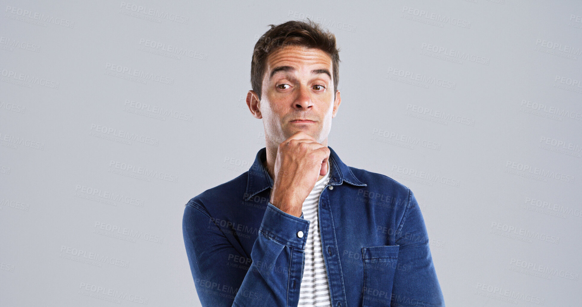 Buy stock photo Thinking, man and doubt for solution in studio for planning, ideas and guess expression of fake news. Mockup space, male person and uncertain of problem solving, question decision and gray background