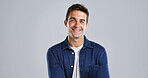Portrait, man and smile with pride for fashion with casual clothes, trendy style and studio. Mockup, happy and male person with cool outfit, denim jacket and positive attitude on gray background 
