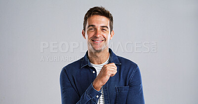 Buy stock photo Happy, man and thinking with portrait in studio for planning, ideas and positive attitude. Mockup space, male person and smile for problem solving, good news and choice of solution on background