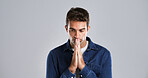 Man, prayer hands and stress in studio with faith, questions and hope for depression by background. Person, sad and reflection for religion, mindset and mock up space for spiritual guide from God