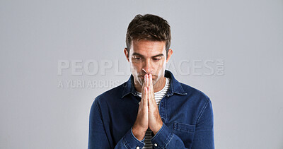 Buy stock photo Man, prayer hands and stress in studio with faith, questions and hope for depression by background. Person, sad and reflection for religion, mindset and mock up space for spiritual guide from God
