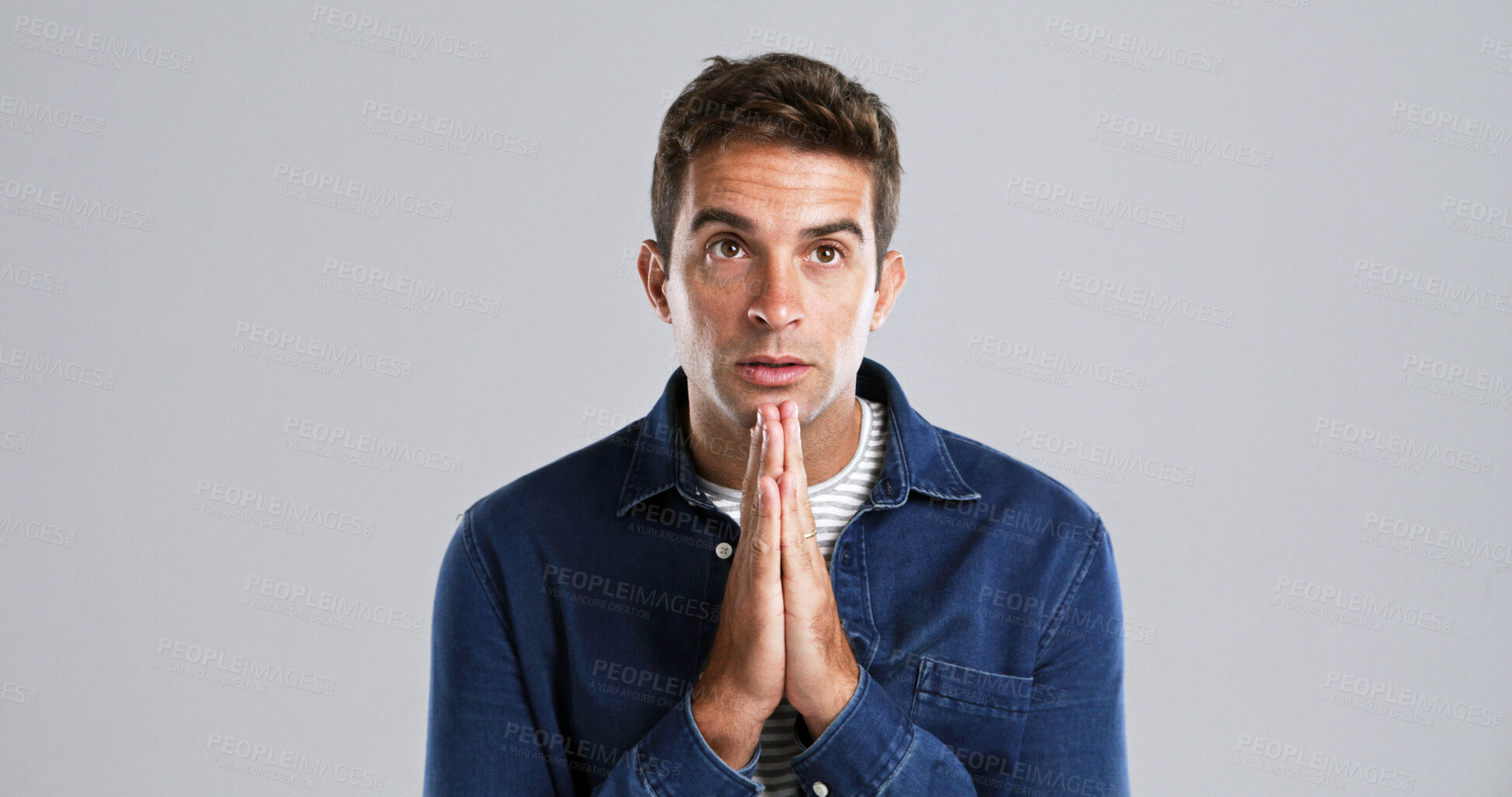 Buy stock photo Man, prayer and hope in studio for faith, praise or trust with love for Jesus Christ by white background. Person, hands and reflection for religion, mindset and spiritual worship for God with space